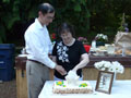 Phil and Lyn Cutting Cake